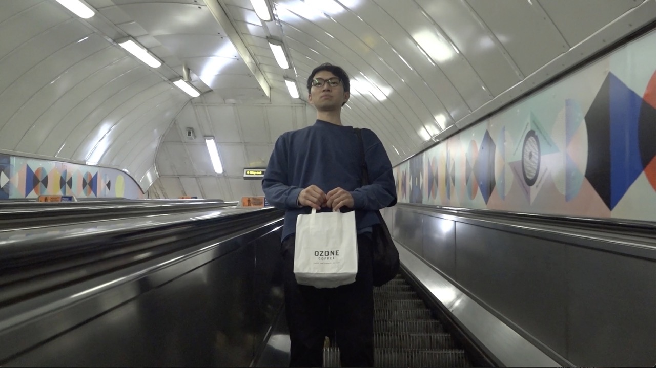 A passenger on an underground escalator